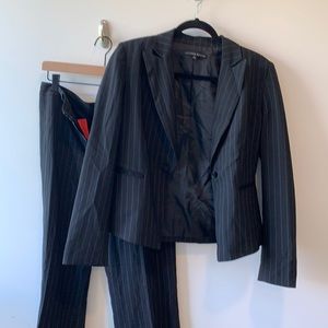 Woman’s pinstripe suit. Just starting career? This works.